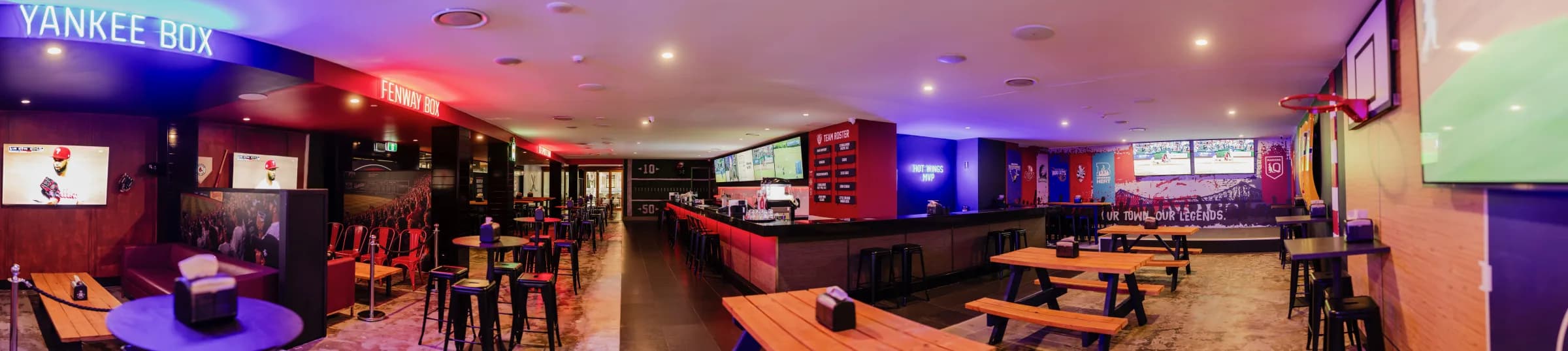Panoramic view across KG Sports Bar, including the Yankee Box, bar and big screens